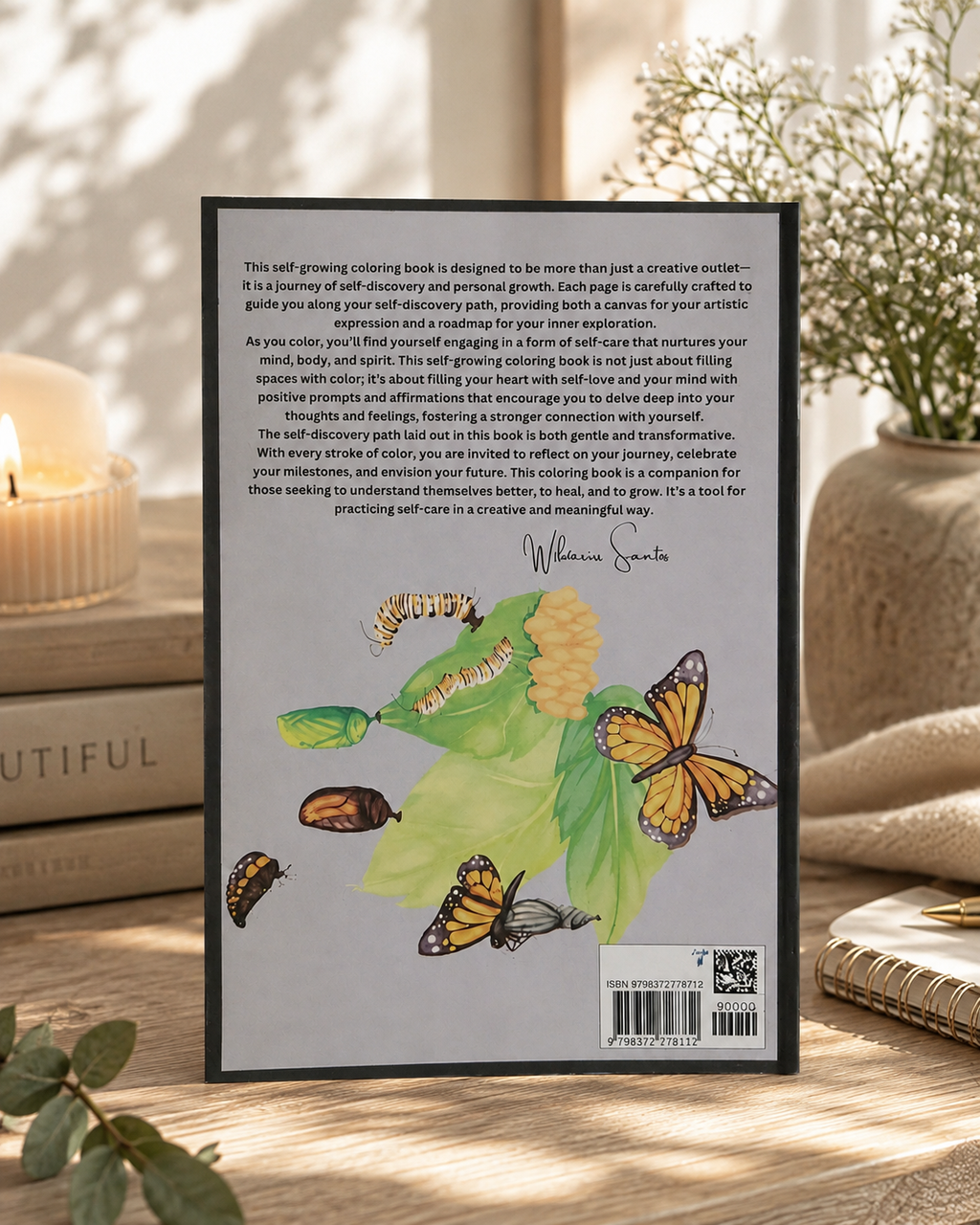 The back cover of a book titled 'Metamorphosis Embrace The Beauty Within' by William Santos, displayed on a wooden surface next to a green plant and a beige fabric bag.